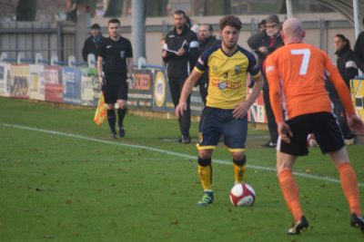 Tadcaster's Josh Grant looks to take on Danny Bunch in the 1-1 draw with Brighouse. Picture: Matthew Appleby