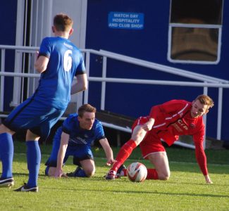 Hemsworth defender Harry Viggars in battle with Ollie Fearon