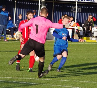 Mansfield goalkeeper Jason White clears his lines