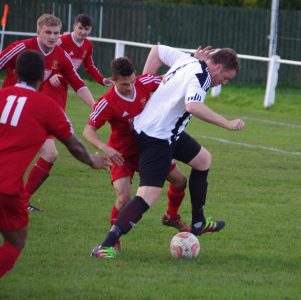 Lovell gets the better of Selby left-back Craig Maynard 